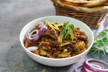 Lachha Paratha or Indian layered Roti with Pork Fry, selective focus