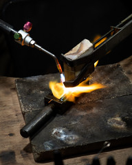 Goldsmith making gold wedding rings