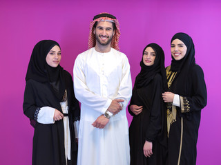 portrait of young muslim people isolated on pink