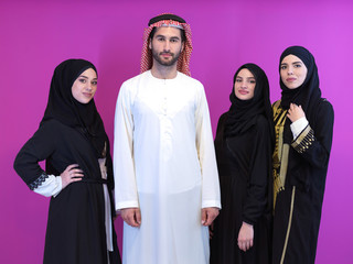 portrait of young muslim people isolated on pink
