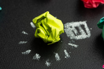 Macro. Good idea concept crumpled paper ball light bulb