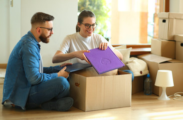 Young couple moving in to new home together