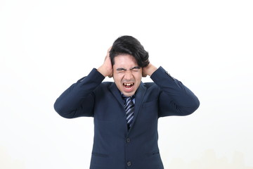 South east Asian Malay Man facial expression angry upset shocked angry eyes closed hand on head ear