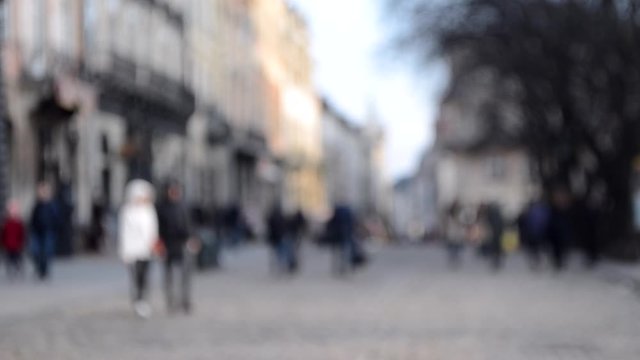 Abstract Defocused Blurred Background of many people on street square