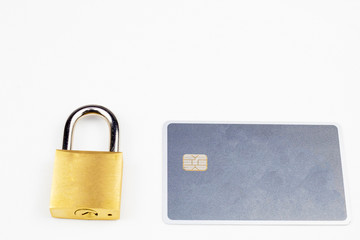 padlock next to an gray credit card