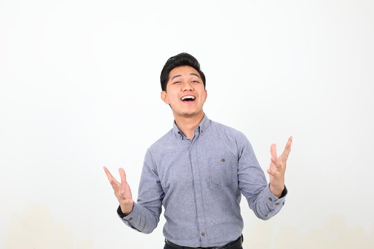 South East Asian Malay Man Facial Expression Happy Exited Laughing Arms Spread