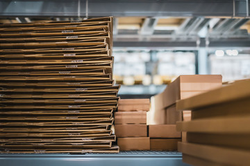 Stack of cardboard boxes in smart warehouse industry logistic.