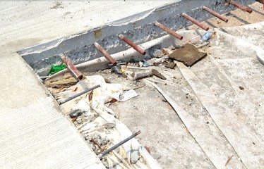 Dowel bar and tie bar in concrete pavement at concrete road construction site.Steel bracket.DB16 and RB32 steel.
