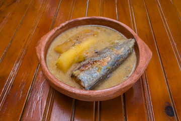 The traditional fish soup up close in a bowl on the table. Colombian cuisine