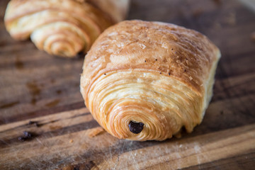 close up of croissants on a wooden table