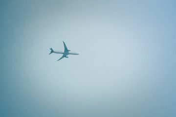Fototapeta na wymiar Airplane in the sky on a sunny day.
