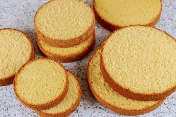 Oven baked and sliced sponge cake.
