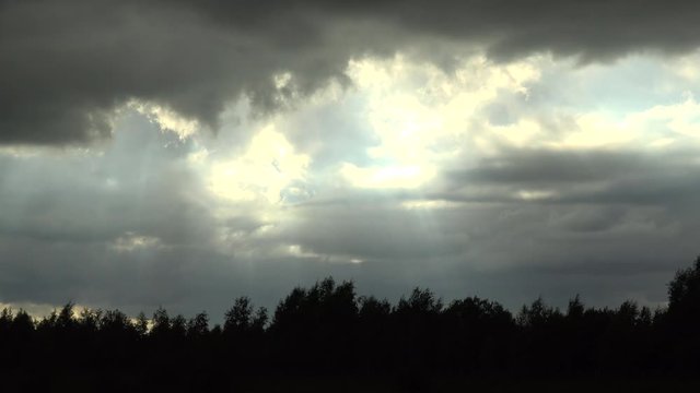 Time lapse of sky and sun rays over english landscape UK 4K
