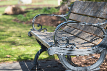 Old vintage style park bench made of cast iron and wood