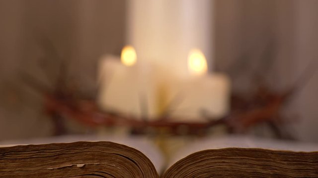 3 lit Candles Surrounded by Crown of Thorns and open Bible in front. Communion