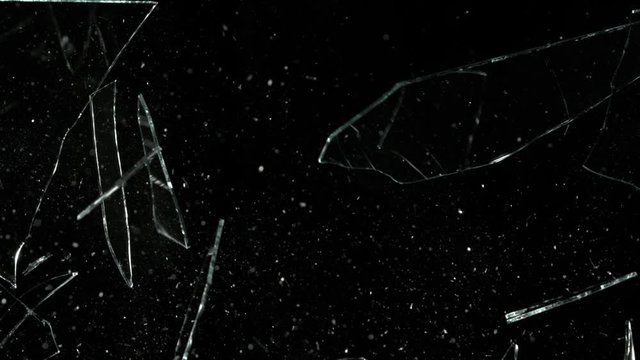 Super Slow Motion Shot of Real Glass Break at 1000 fps Isolated on Black Background.