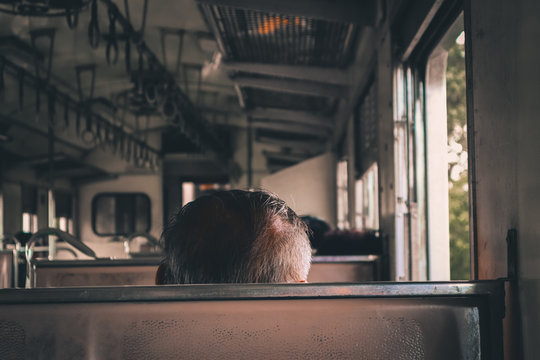 Rear View Of Man In Train