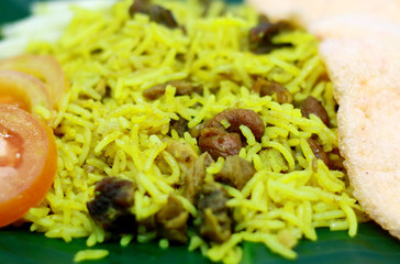 Kebuli rice or Nasi Kebuli on banana leaf.