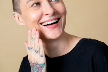 Cool happy skinhead tattooed woman