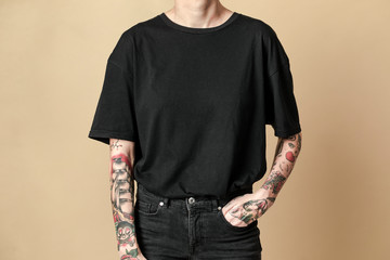 Cool tattooed woman in black clothes