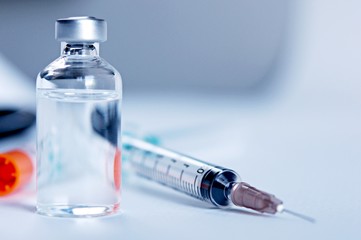 Medicine in vials and syringe , ready for vaccine injection , Cancer Treatment , Pain Treatment and can also be abused for an illegal use, healthcare and medical concept vaccination.