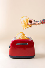 Tattooed hand making toasts