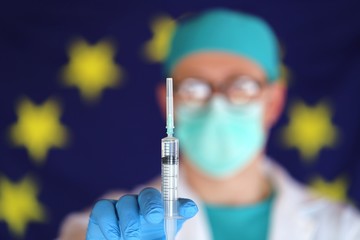 Virus vaccine. Coronavirus treatment in Europe.Virus vaccination in the European Union.Doctor in...