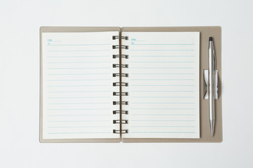 Top view of Pen, notebook  on white background