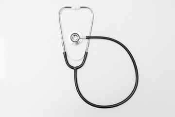 Fototapeta na wymiar Top view of stethoscope on a white background
