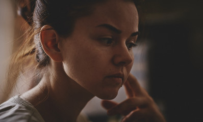 Photo of a girl in a white shirt, dark background