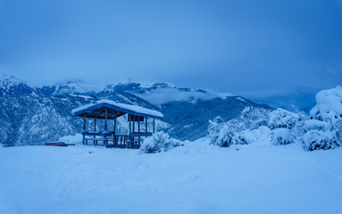 Fototapeta premium A resting shed covered with snow during evening near Talcha Airport in Mugu, Nepal.