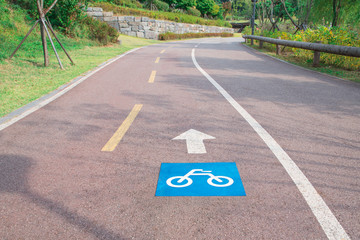Sign of bicycle lane on asphalt road
