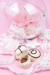 Christmass New Year decorations. Greeting card. White chocolate candy, Christmass ball with pointe shoe. Tender pink color.
