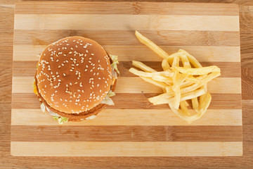 Obraz na płótnie Canvas Tasty burger and fries