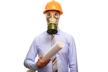 A protected engineer in a gas mask, helmet, shirt and tie holds drawings, looks into the camera. Isolated