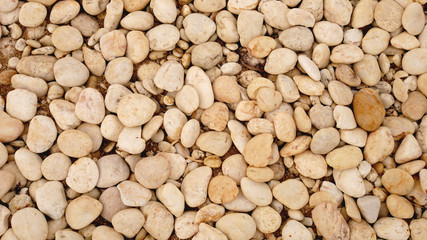 pile of stones nature background. white pebble beach