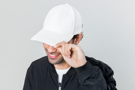 Happy man wearing a white cap