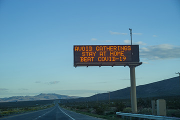 Avoid Gatherings Stay At Home Highway Sign