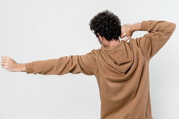 Man in a brown hoodie isolated on white background