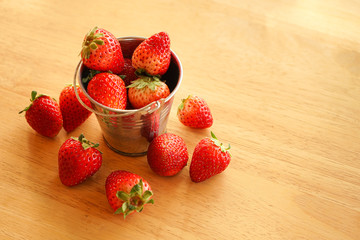 strawberries on wooden background