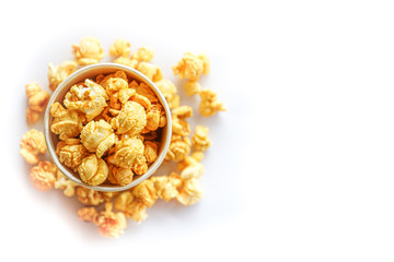 Top view of popcorn in paper glass on white background with copy space