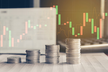 Stack of money coin with trading graph, financial investment concept can be use as background