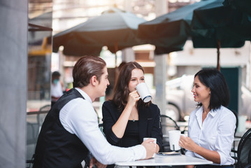 Group of Diversity Young Businesspeople Friends Casual Meeting and Relax Together at Coffee Shop - Teamwork and Relax Concept