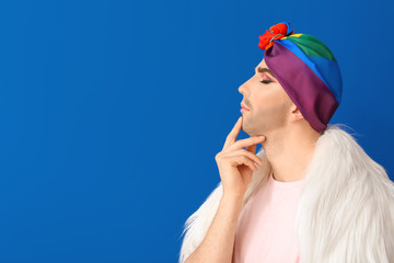 Fototapeta premium Portrait of young transgender woman on color background