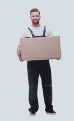 man in workwear with cardboard box isolated on white background