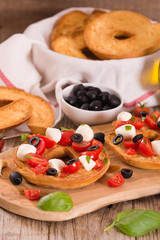 Friselle with tomatoes and mozzarella cheese.
