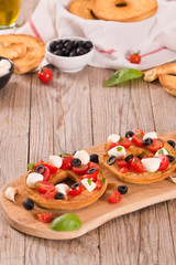 Friselle with tomatoes and mozzarella cheese.
