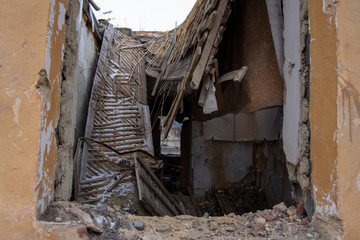 Old house, collapsed ceiling, wooden floors, old staircase, second floor without walls and ceiling...