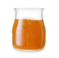 Jar of orange jam on white background