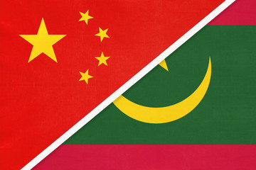 China or PRC vs Mauritania national flag from textile. Relationship between Asian and African countries.